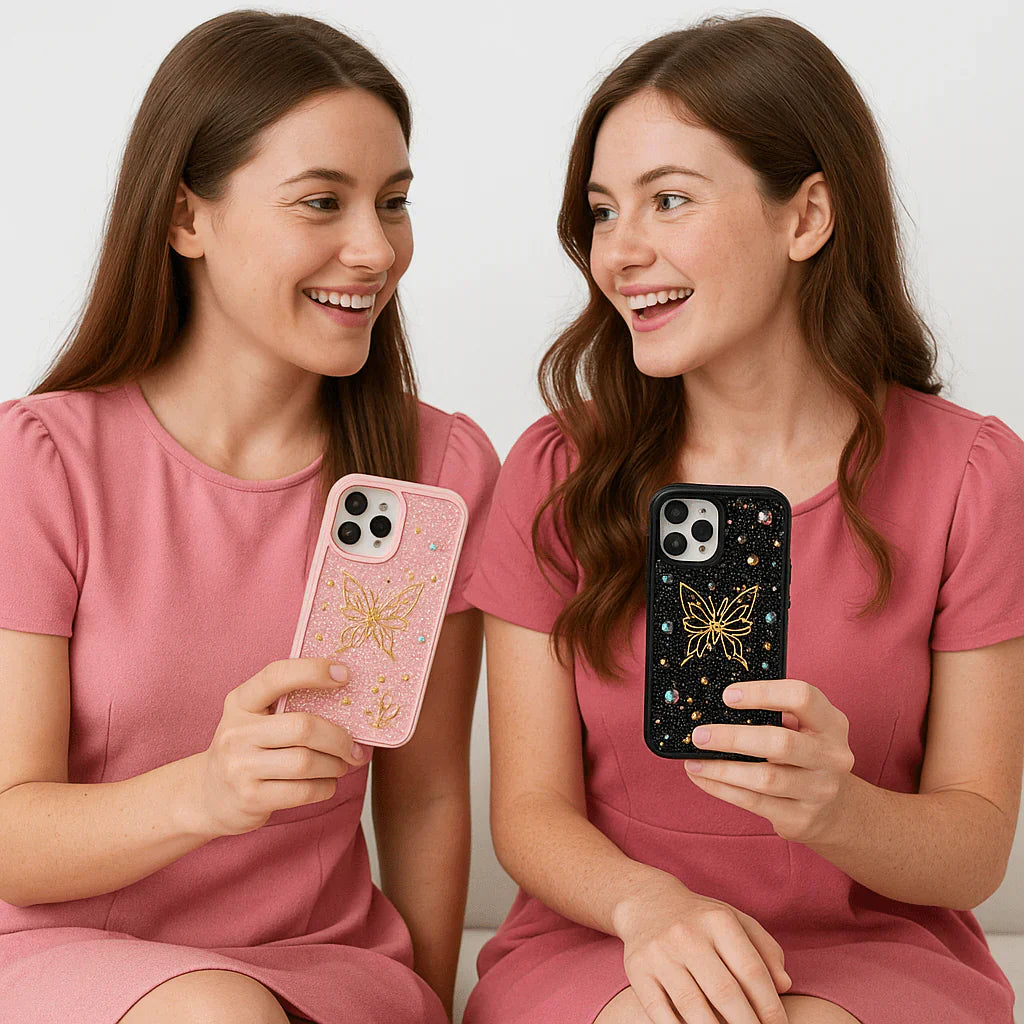 Two women in pink dresses holding phone cases with butterfly designs.