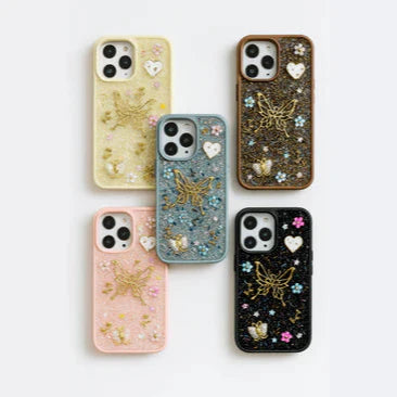 Set of six decorated phone cases on a white background
