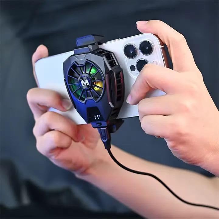 Gaming controller with a fan attached held by hands against a dark background Emirvaly