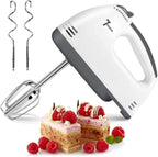 Hand mixer with attachments and a dessert featuring raspberries on a white background Emiravaly Uae