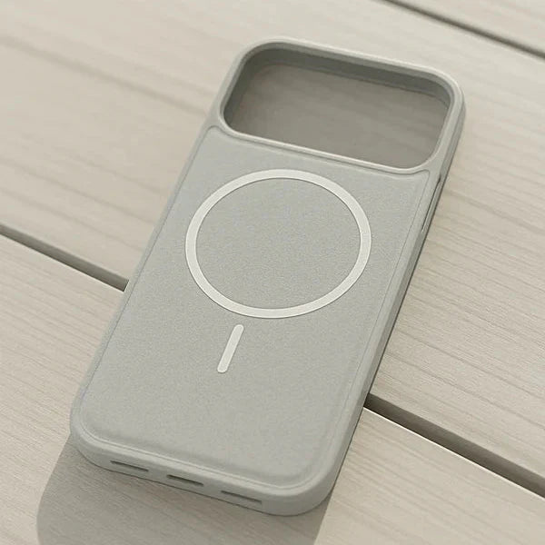 Gray phone case with a circular design on a wooden surface