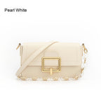 Pearl white handbag with gold accents on a white background emiravaly uae