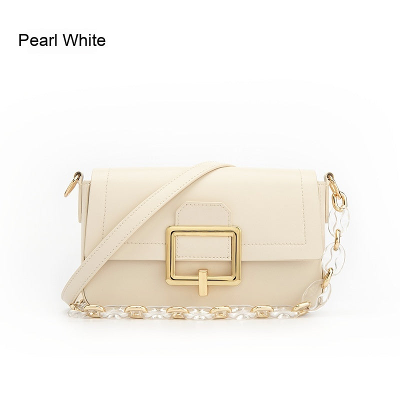Pearl white handbag with gold accents on a white background emiravaly uae