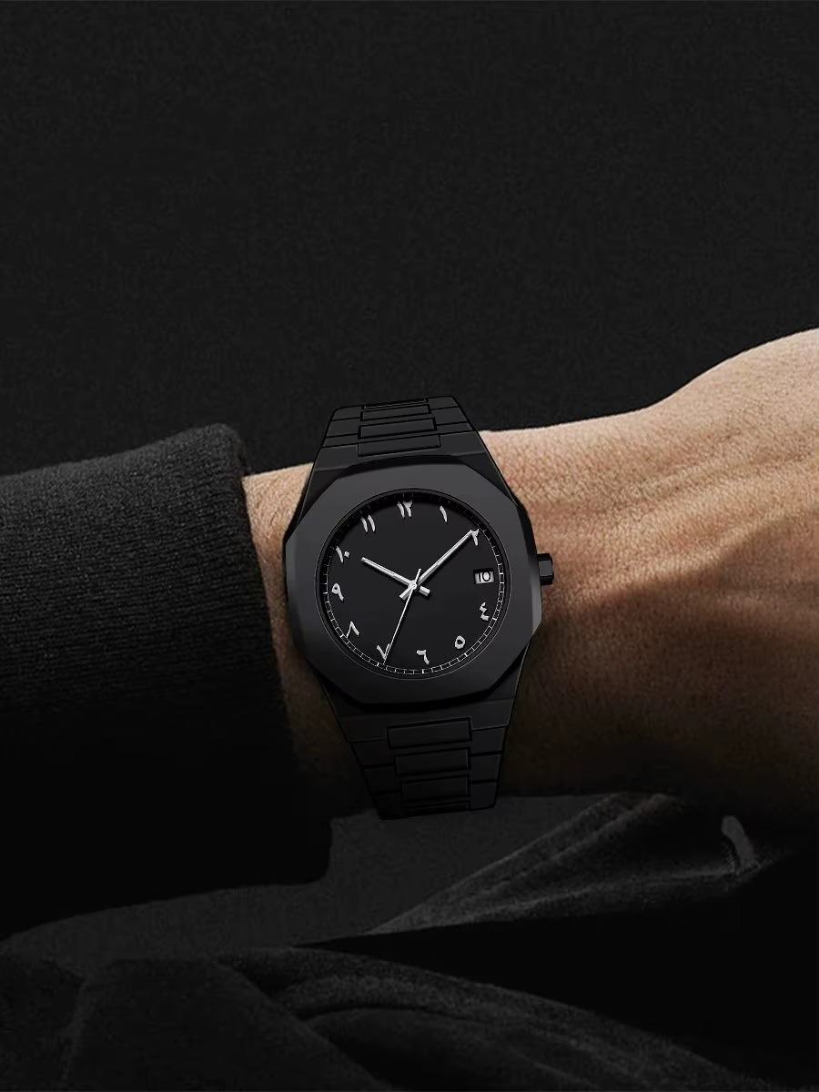 Black watch on a wrist against a dark background